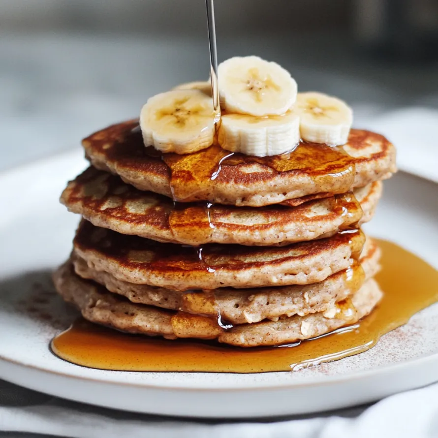 A stack of pancakes with syrup on top.